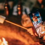 Screen Burn-In - Man Recording on His Smartphone Women Roasting Marshmallow