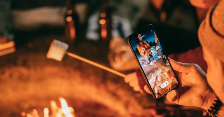 Screen Burn-In - Man Recording on His Smartphone Women Roasting Marshmallow
