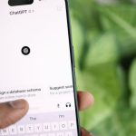 Display Technologies - A person holding an iphone with the keyboard on it