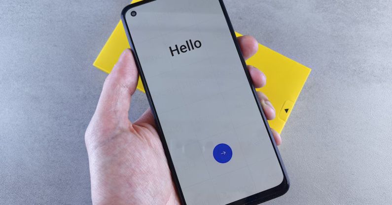 Touchscreen Sensitivity - A person holding a smartphone with the word hello on it