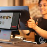 Touchscreens - Cashier Using Touchscreen