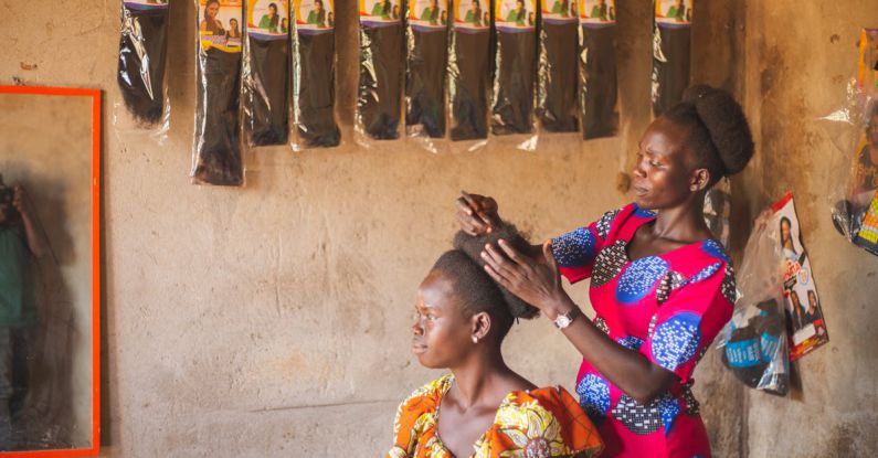Streaming Services - A woman is getting her hair done in a shop