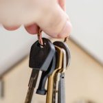 Key Features - Person with keys for real estate