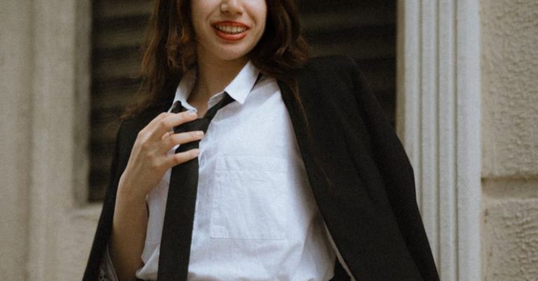 Mini-LEDs - A woman in a skirt and blazer posing for a photo
