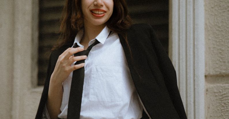 Mini-LEDs - A woman in a skirt and blazer posing for a photo