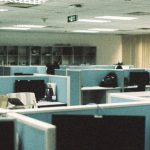 Curved Monitors - An empty office with cubicles and desks