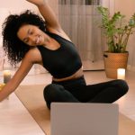 Flexible Screens - Woman with Curly Hair Doing Stretching
