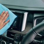 Screen Maintenance - Crop person wiping modern car panel