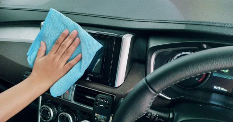 Screen Maintenance - Crop person wiping modern car panel