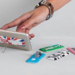 Foldable Phones - Multicolored Foldable Smart Phone Stands Lying on a Table