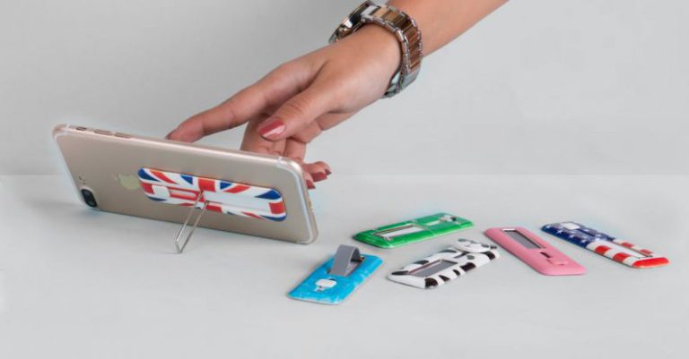 Foldable Phones - Multicolored Foldable Smart Phone Stands Lying on a Table