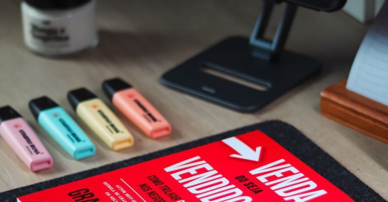 Portability - A book on a desk with a computer and keyboard