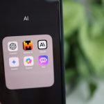 Future Applications - A person holding an iphone with the app icons on it