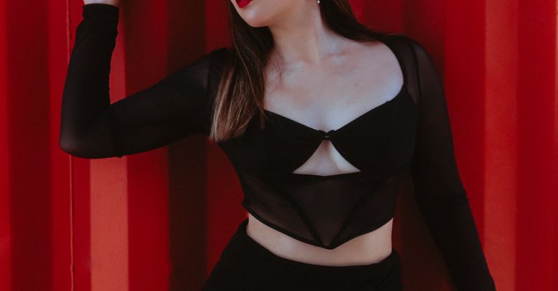 Color Calibration - Woman Posing in Front of Red Curtain