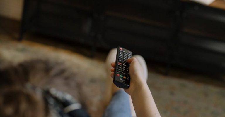 Screen Cleaning - Person Holding Black and Silver Remote Control